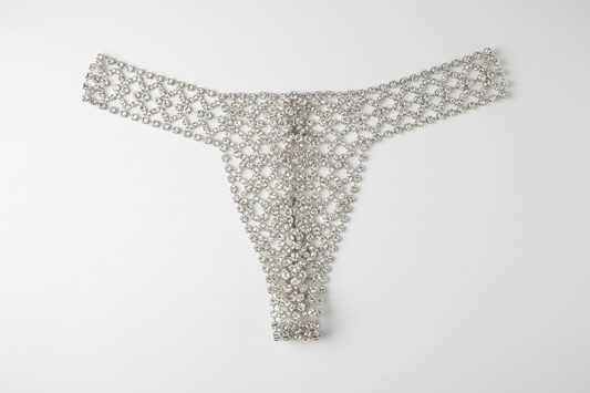 Close-up of rhinestone underwear showing crystal embellishments and smooth fabric lining, fashion accessory detail